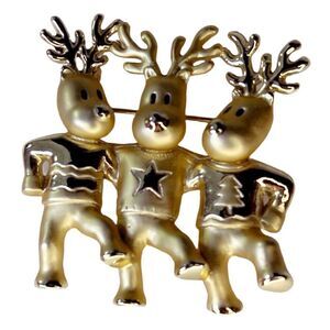 Vintage AJC three dancing deer gold tone brooch.